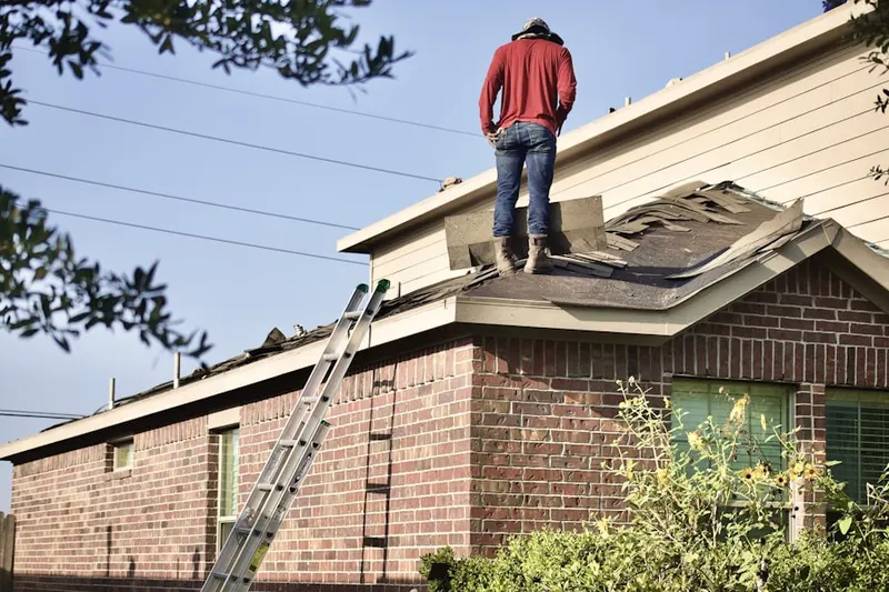 Professional roofer working on a residential roof in Truckee